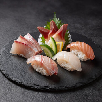 Gothic Sushi Egg. Black Stone Plate Showcases A Set Of Sushi Sashimi
