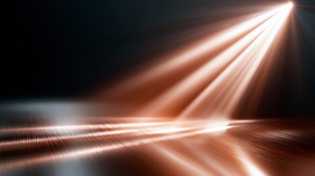 A beam of warm light shines diagonally across a reflective surface, creating a pattern of glowing lines and a dramatic contrast against a dark background.