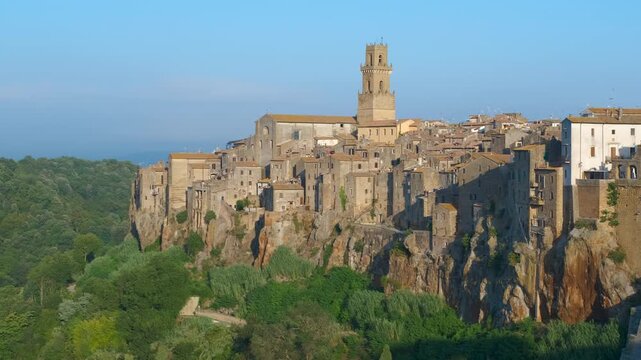 Scenic panorama of pitigliano village in tuscany. Stunning panoramic view of the ancient town of pitigliano, a medieval village perched on a tuff cliff in tuscany, italy