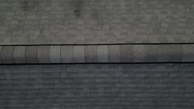 aerial view of rooftop shingles on roof of suburban rural house in upstate new york usa (chimney tiles trees sunset sun shine tone) countryside home roofing brick shale concrete asphalt fiberglass
