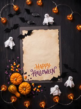 Happy Halloween Background with Spooky Decorations, Bats, Ghosts and Copy Space