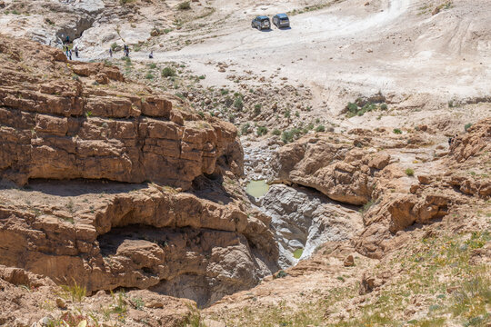 Looking down on two small pools of water near Nahal Rahaf-Rahaf Stream in the Judean Desert in Israel.
