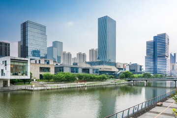 Naklejka premium Modern Urban Landscape: A Serene Morning Over City Waters