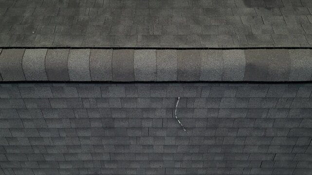 aerial view of rooftop shingles on roof of suburban rural house in upstate new york usa (chimney tiles trees sunset sun shine tone) countryside home roofing brick shale concrete asphalt fiberglass