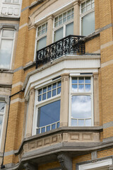 Obraz premium Brussels, Belgium. Ornate bay window and wrought iron balcony on a historic townhouse near the Ixelles Ponds