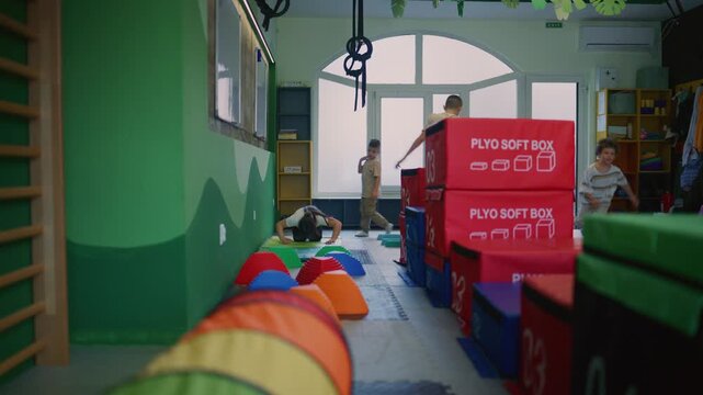 Kids actively participate in various fitness exercises and an engaging obstacle course. Children develop their physical skills and coordination during playful gym time.