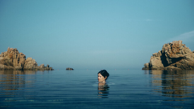 woman swimming on the beach in Sardinia