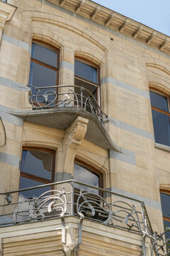 Brussels, Belgium. Art Nouveau residential facade with ornate wrought iron balconies in Ixelles