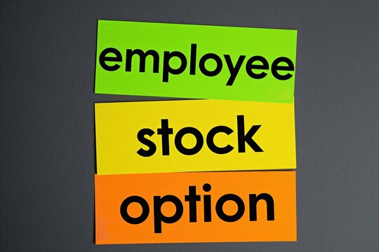 Three colorful paper notes with text Employee Stock Option on dark background. Shows business benefit for staff, company ownership program, reward concept. Helps in financial planning. Motivating