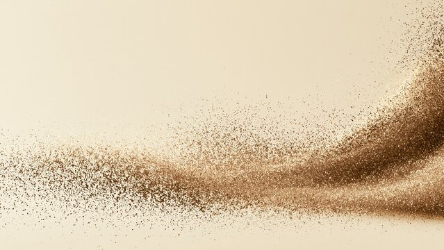 Gold sand particles forming an elegant arc on a light background
