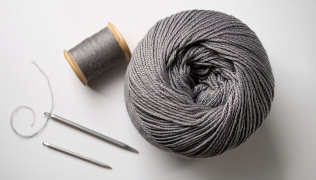 overhead product photo of gray premium wool yarn cone and knitted sample for handmade textile and hobby shop content