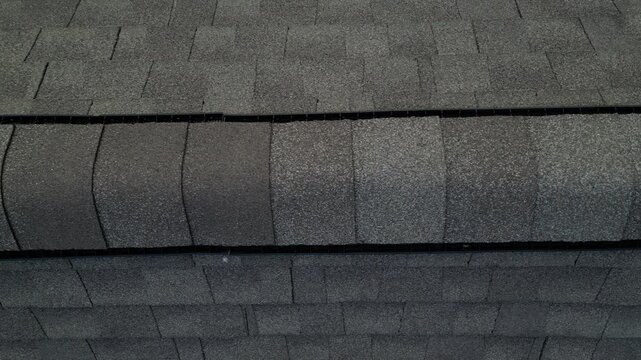 aerial view of rooftop shingles on roof of suburban rural house in upstate new york usa (chimney tiles trees sunset sun shine tone) countryside home roofing brick shale concrete asphalt fiberglass
