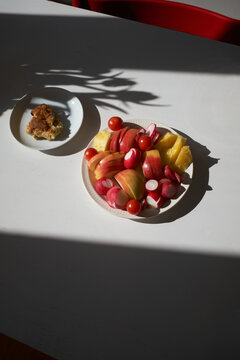 Sunlit Table with Fruit and Cake