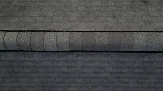 aerial view of rooftop shingles on roof of suburban rural house in upstate new york usa (chimney tiles trees sunset sun shine tone) countryside home roofing brick shale concrete asphalt fiberglass