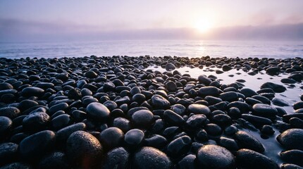 Obraz premium The First Ray of Dawn on the Pebble Shoreline