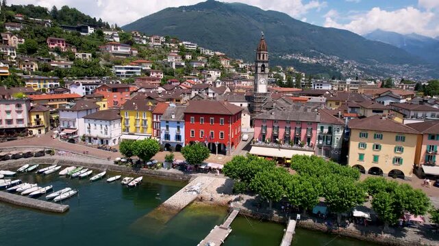 Cinematic Aerial Drone View of Colorful Ascona Village Lake Maggiore Switzerland Historic Clock Tower Scenic Waterfront Promenade Vibrant Lakeside Architecture Authentic Ticino 4K Travel Footage