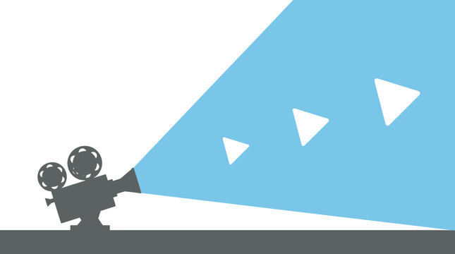 A spotlight shines on a movie projector in a dark room with triangles flying out.