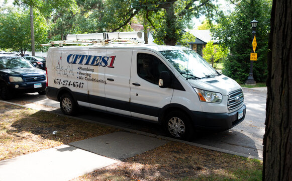 Cities1 plumbing, heating and air conditioning service truck making house call. St Paul Minnesota MN USA