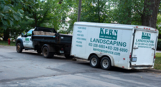 Kern's Landscaping with truck and trailer filled with equipment. St Paul Minnesota MN USA
