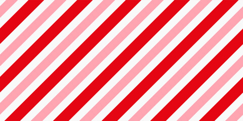 Fototapeta premium Candy cane Christmas background, peppermint diagonal stripes print seamless pattern