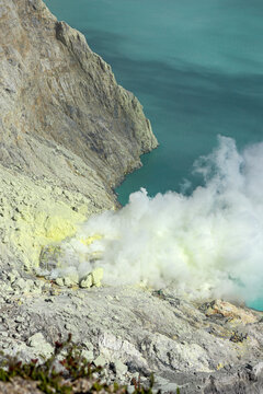 Active sulfur volcano crater in Indonesia