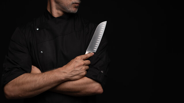 Portrait of positive 50s mature chef cook, black outfit