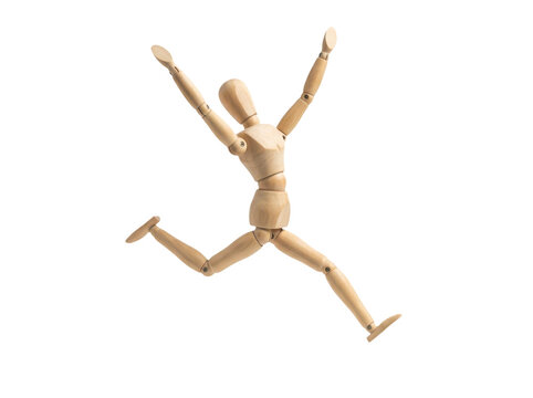 Wooden mannequin figure jumping in the air with arms raised high isolated on transparent background