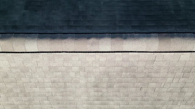 aerial view of rooftop shingles on roof of suburban rural house in upstate new york usa (chimney tiles trees sunset sun shine tone) countryside home roofing brick shale concrete asphalt fiberglass
