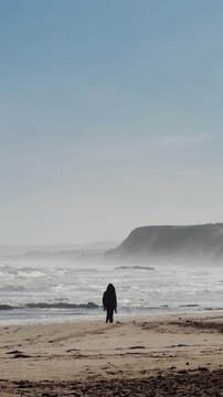 Silhouette walking along Baleal cliffs overlooking Atlantic Ocean

Atmospheric silhouette walking along the dramatic coastline of Baleal in Portugal with rugged cliffs, ocean waves and soft coastal