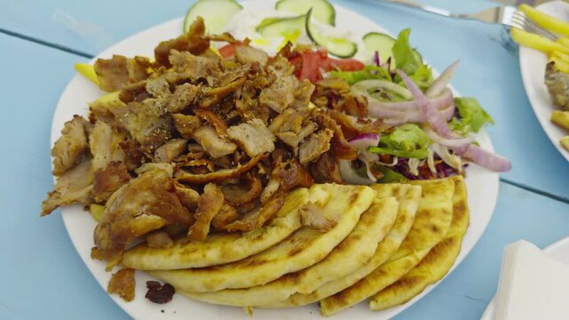Greek Gyros Served With Grilled Pita Bread Shaved Roasted Meat And Fresh Salad. Mediterranean Food 