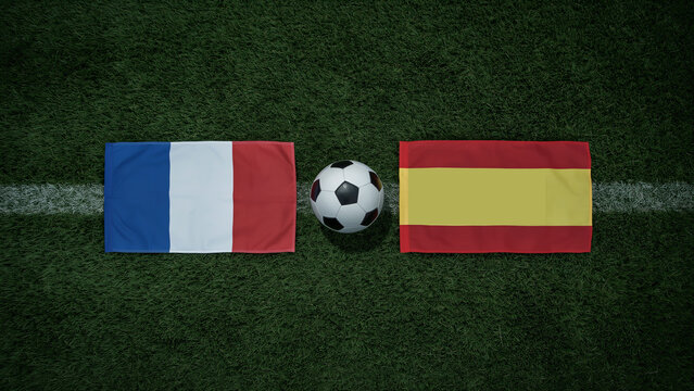 France vs spain soccer flags and ball on green field