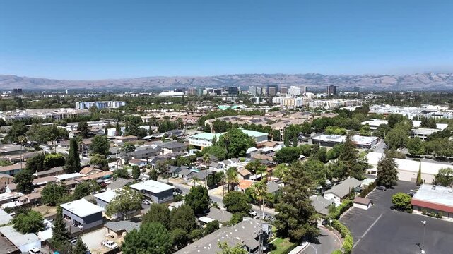 San Jose, California, USA - Wide Drone View of Downtown Skyline With Residential Neighborhoods and Diablo Range Mountains on a Clear Sunny Day