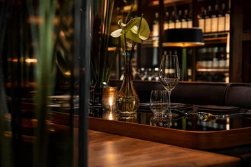 Fotobehang Horeca Mirrored Lounge Table With Layered Restaurant Depth And Contemporary Cafe Dining  © borisk.photos