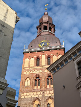 View of old ancient Riga Cathedral Church Tower and Golden Rooster on Top in Latvia
