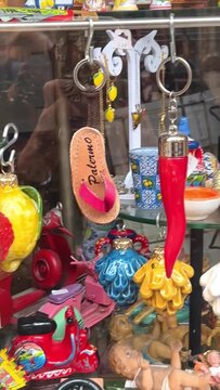 Sicily Palermo typical souvenirs and gifts at budget, street market vendors of traditional good luck bringer souvenirs.