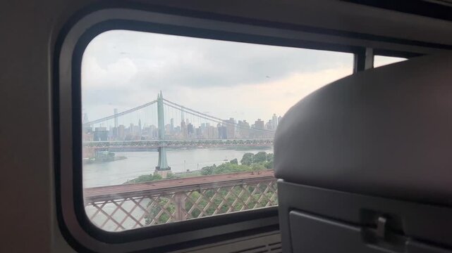 Bridge and city skyline view from train window