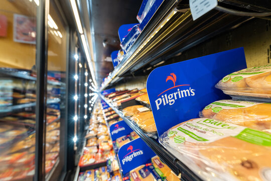Trays with raw chicken meat by Pilgrims brand, owned by JBS company, arranged inside the refrigerators of the meat section at a supermarket for retail sale. Jalisco, Mexico, July 20 2026