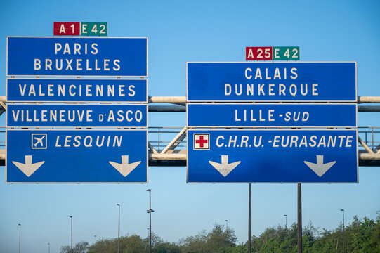 View of a French and European autoroute with overhead directional signs pointing to major cities like Paris, Bordeaux, Lille, Calais, showing lanes, traffic and motorway infrastructure, road signes