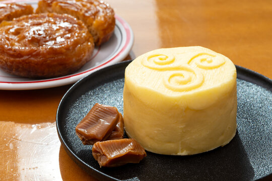 Food of Brittany, hand-made farm salted butter, Kouign-amann legendary Breton confection, caramel with butter, authentic Breton food with centuries-old tradition
