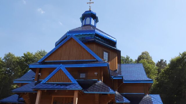 the church is covered with blue tin