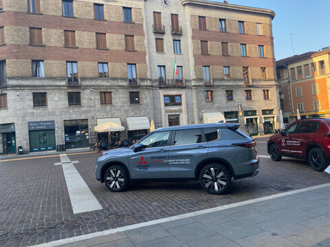 New Mitsubishi Outlander and Mazda CX 5 cars promoting automotive brands at a launch event in the historic city square