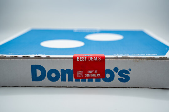Close up of Domino's pizza box with promotional seal. Toronto, Canada - July 8, 2026.