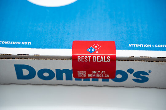 Close up of Domino's pizza box with promotional seal. Toronto, Canada - July 8, 2026.