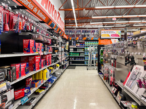 Aisle of the AutoZone auto parts store, by AutoZone Inc., featuring shelves filled with car parts, accessories, and spares for automobiles and motorcycles. Jalisco, Mexico, July 20, 2026