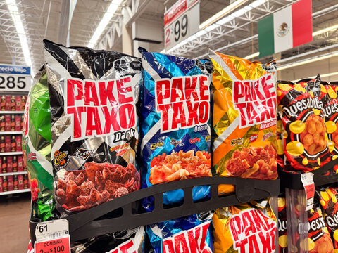 Bags of Pake Taxo assorted snacks by Sabritas PepsiCo displayed on a supermarket shelf. Mix of savory and spicy snacks on retail store racks.  Jalisco, Mexico July 11 2026. Paketaxo, Lays, Pepsi