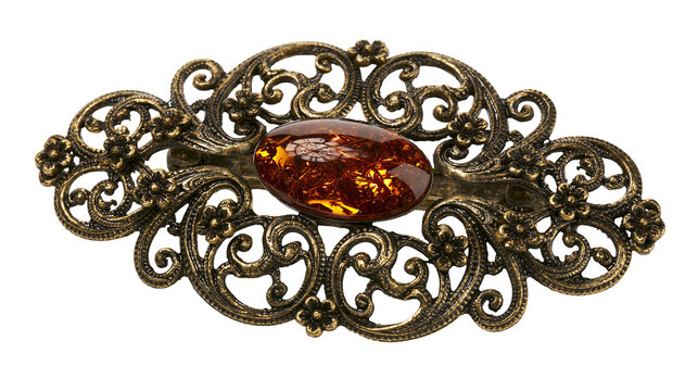 Antique bronze filigree hair clip with oval amber cabochon, isolated on transparent background
