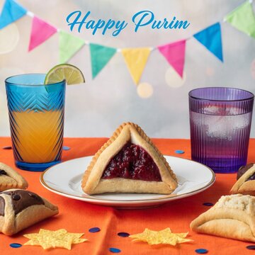 Festive Purim table setting with triangular jam pastries, colorful bunting, star cutouts, patterned drinking glasses, bright orange cloth, and celebratory dessert display