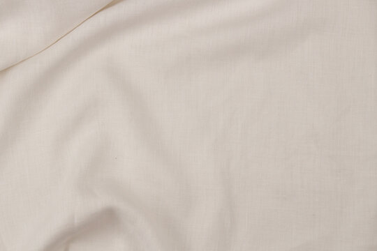 White linen fabric texture background with soft draperies