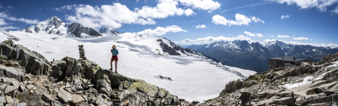 Hiker standing in front of glacier, Glacier du Tour, glacier and mountain peak, high alpine landscape, left Aiguille du Chardonnet, Chamonix, Haute-Savoie, France