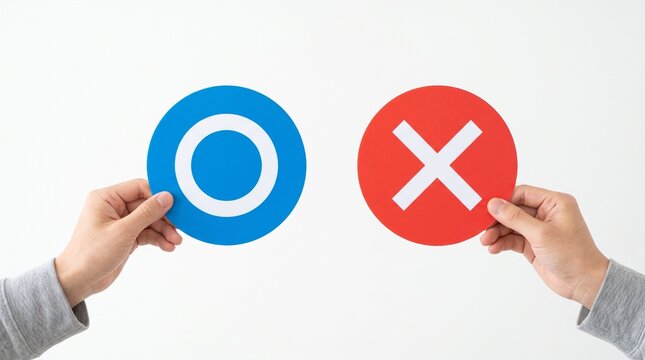 Two hands holding circular signs featuring a blue correct circle symbol and a red incorrect cross symbol isolated against a plain clean white studio background